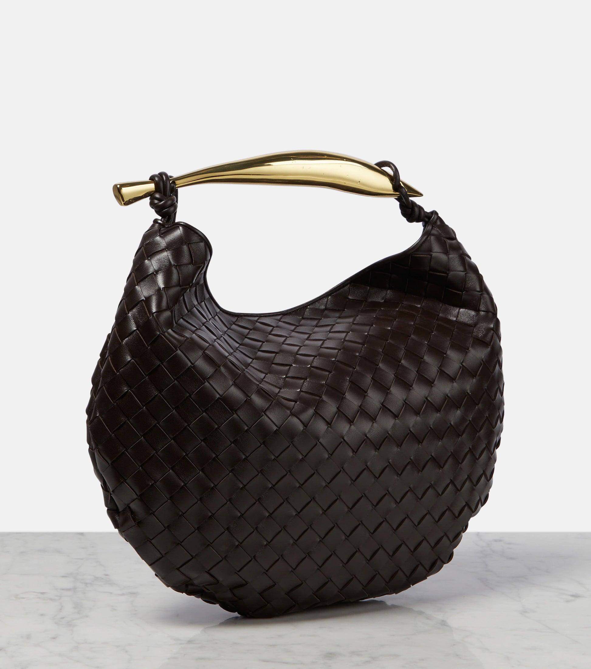 Medium leather bag with golden top